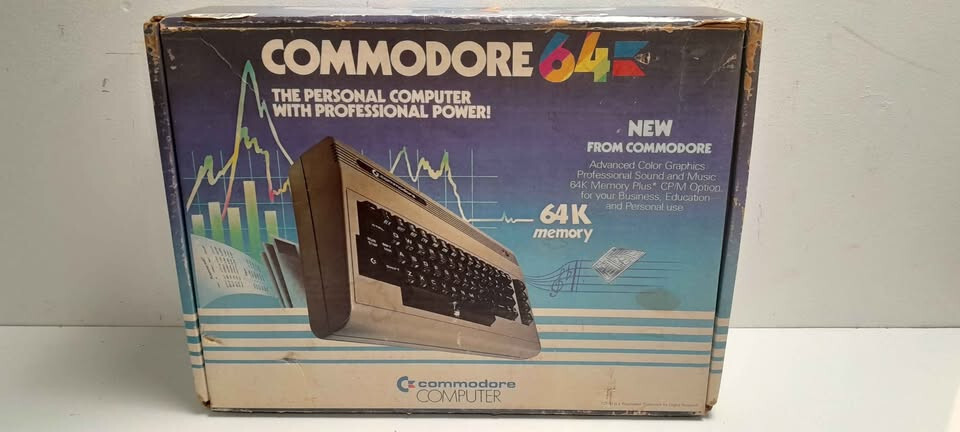 Vintage Commodore 64 computer in box, manuals and programs package