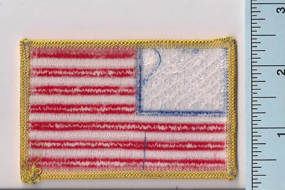 One New American Flag Patch, Embroidered, Plastic Backing, Gold Border