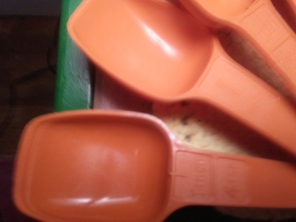 vintage Tupperware measuring spoons burnt orange