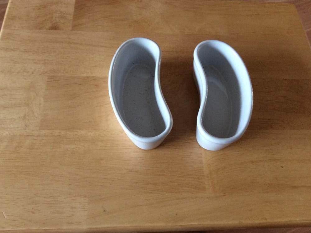 TWO CURVED PORCELAIN BOWLs WHITE