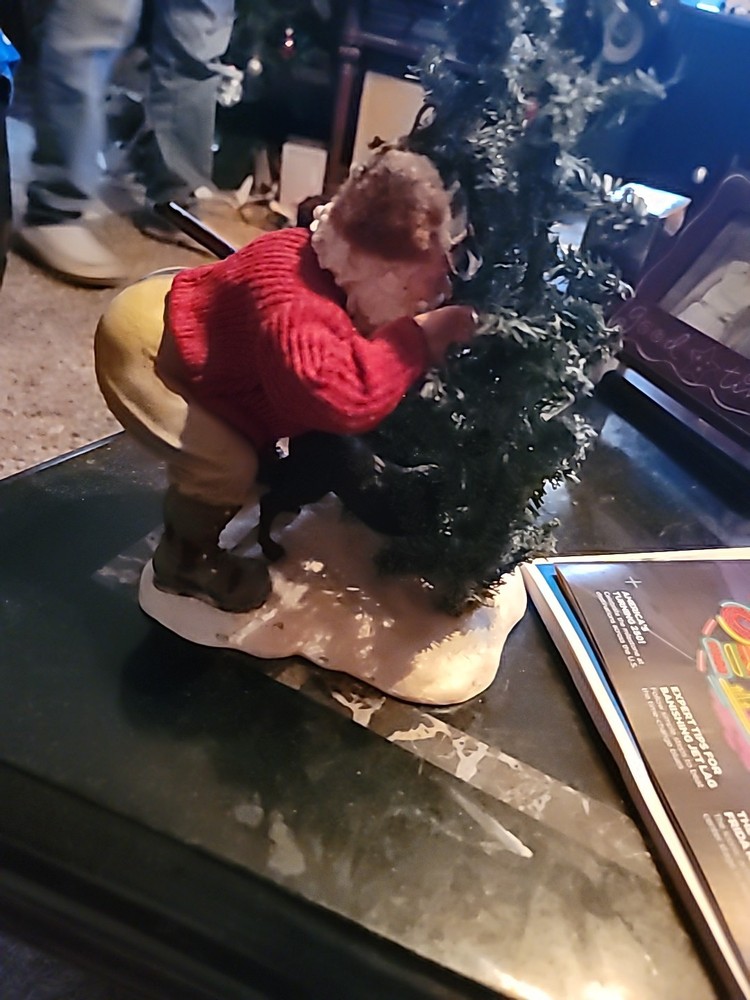 Santa Hiding By A TREE