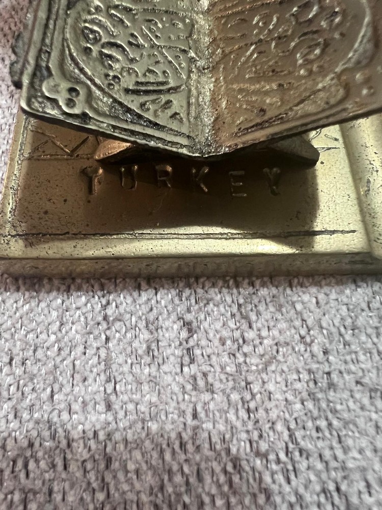 A vintage brass middle eastern scholar sculpture.