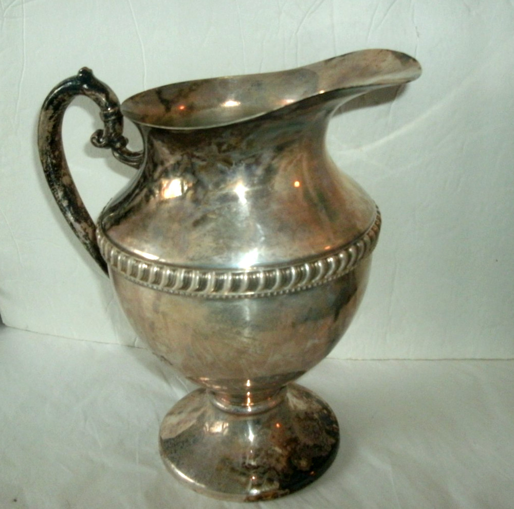 VINTAGE SILVER ON COPPER PITCHER, ENBLEM ON BOTTOM, 9 1/2" TALL
