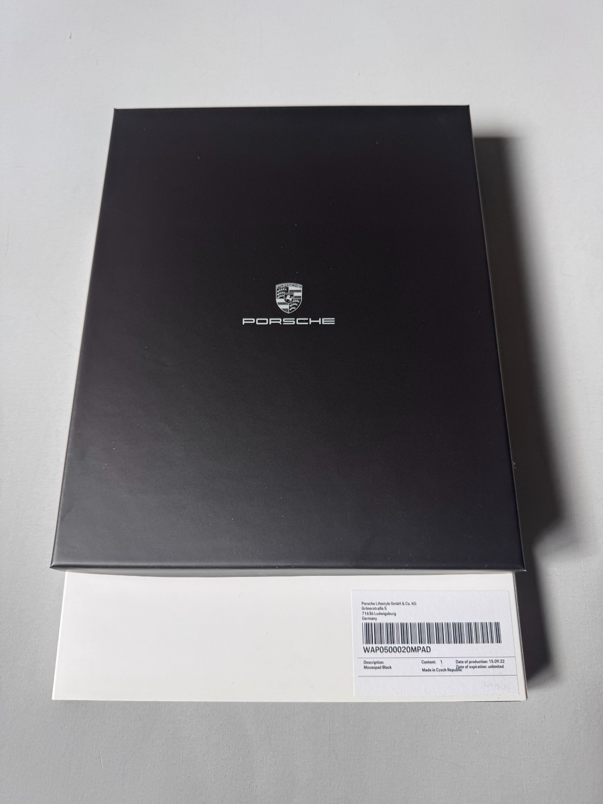 PORSCHE DESIGN EMBOSSED LEATHER COMPUTER MOUSE PAD IN THE SHAPE OF PORSCHE CREST