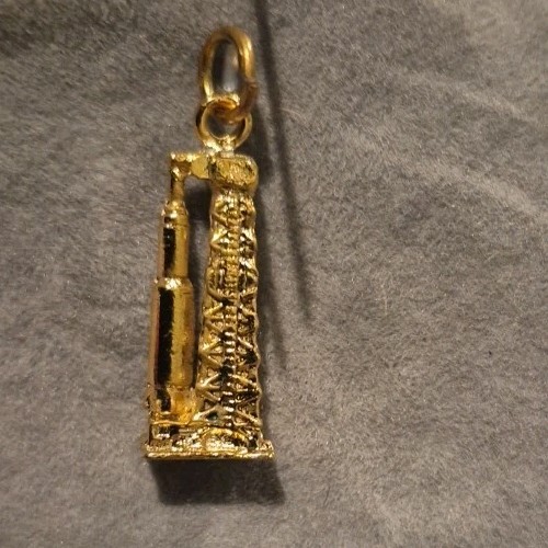Vintage gold-tone Space Shuttle launch pad charm