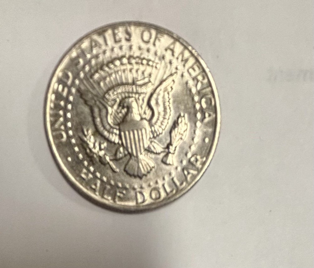 1973 Kennedy Half Dollar With No Mint Mark, Error On E