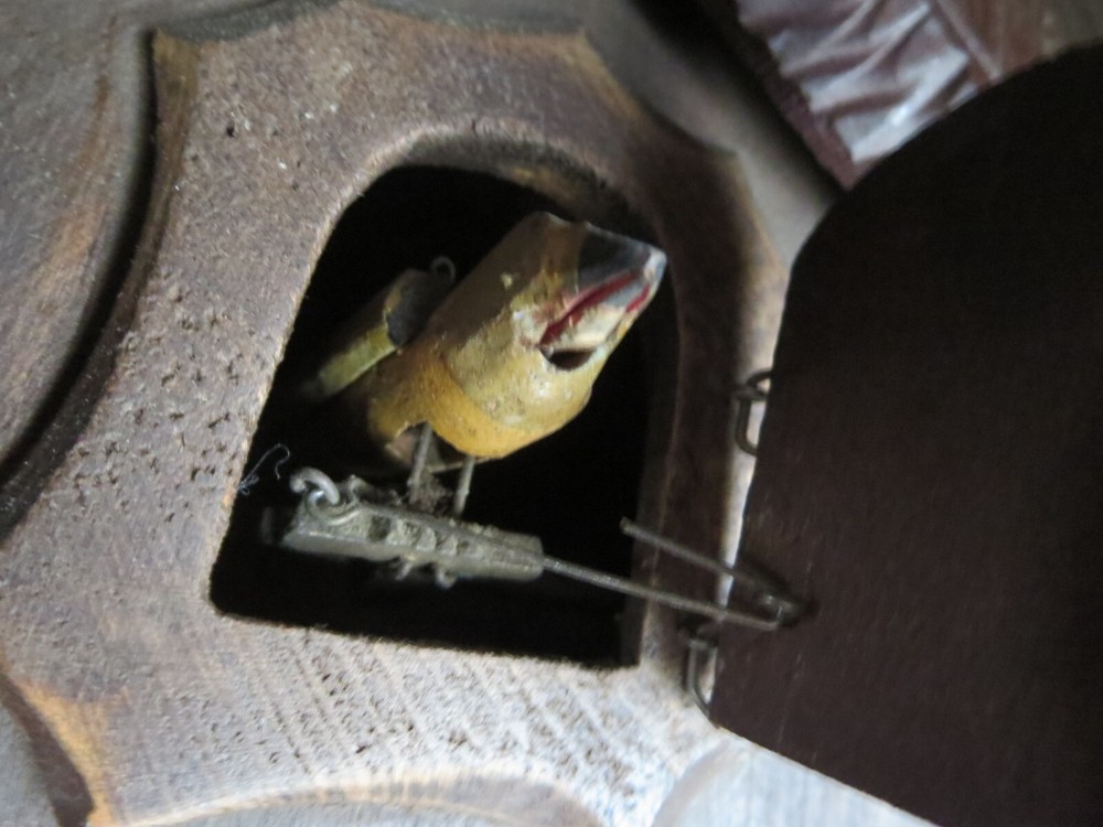 Old Cuckoo clock with articulated bird