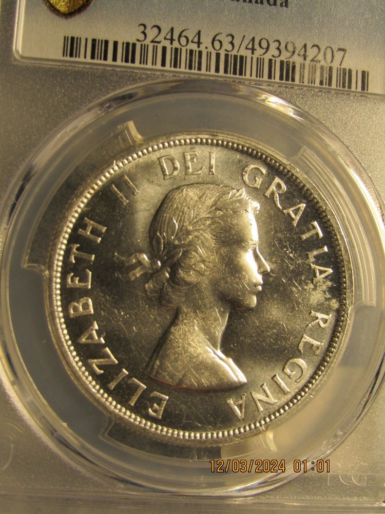 1957 CANADA SILVER $1 DOLLAR...PCGS MS-63..GOLD SHIELD