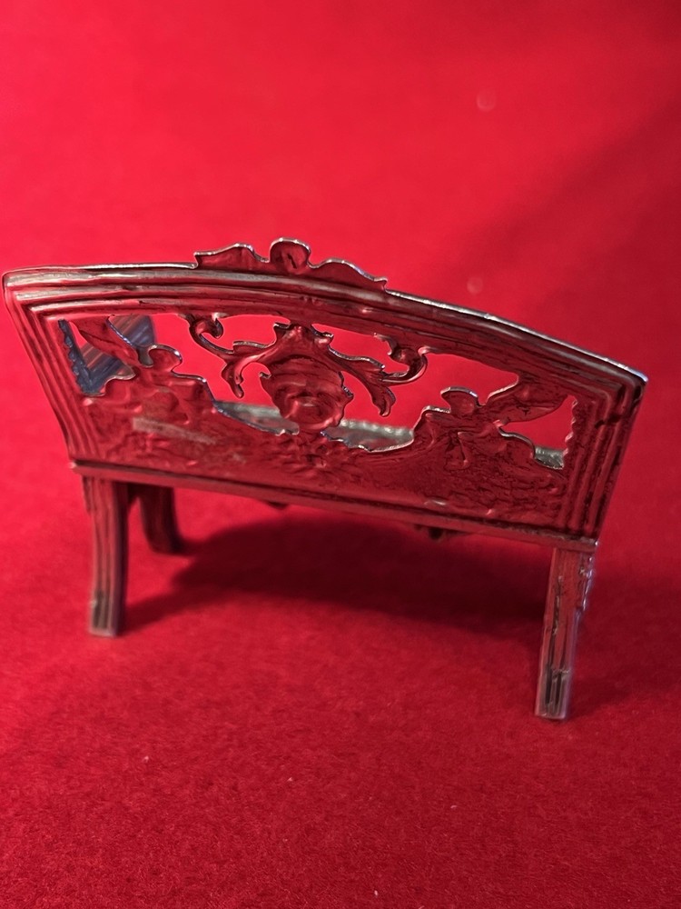 silver miniature bench or sofa intricately designed w/ cupids