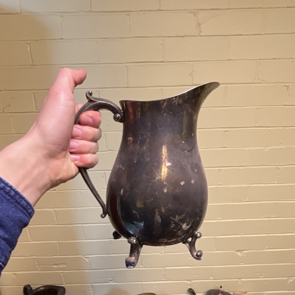 Antique Silverplate Footed Pitcher with Ornate Handle and Decorative Base