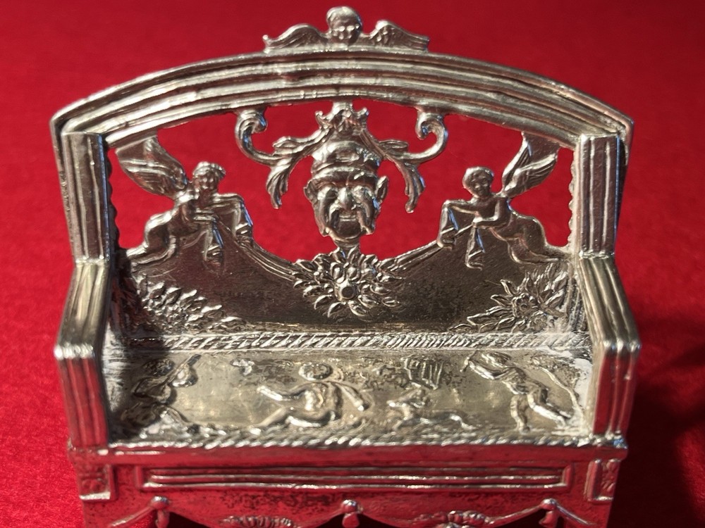 silver miniature bench or sofa intricately designed w/ cupids