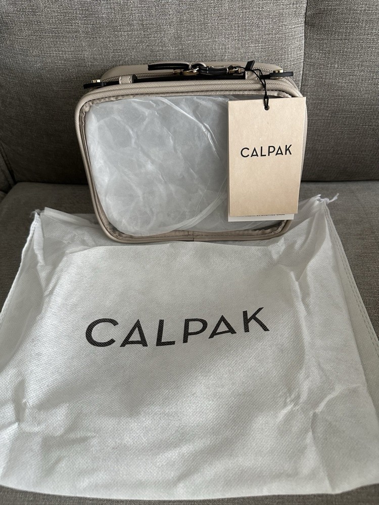 NWT CALPAK Small Clear Cosmetics Case in Stone