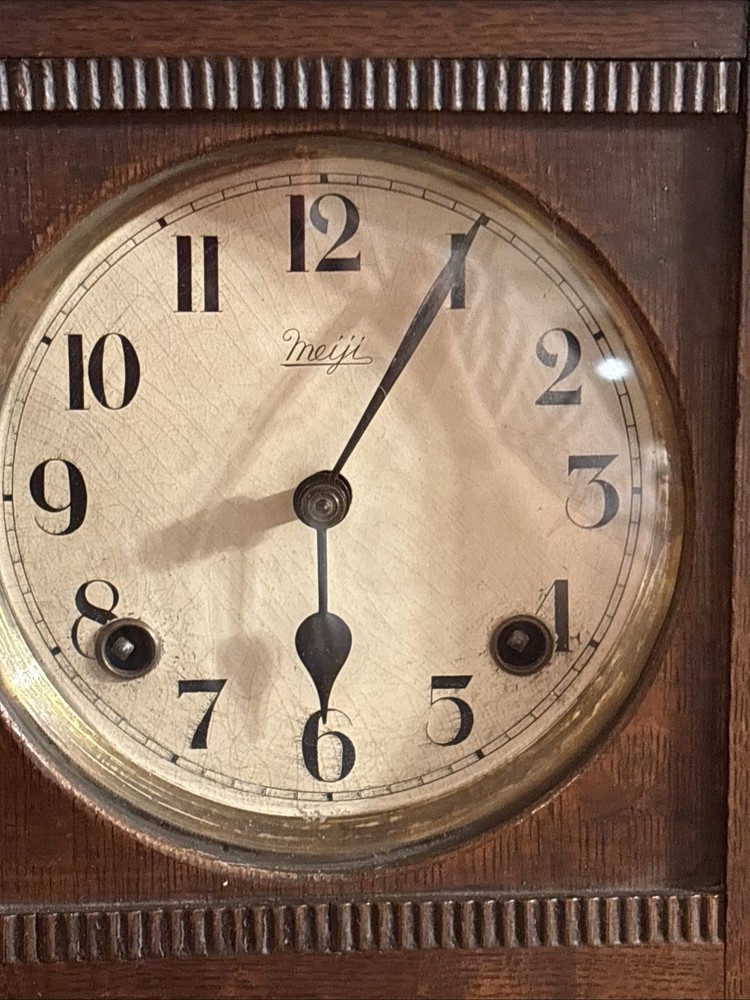 Vintage spring pendulum clock made by Meiji Clock Co.