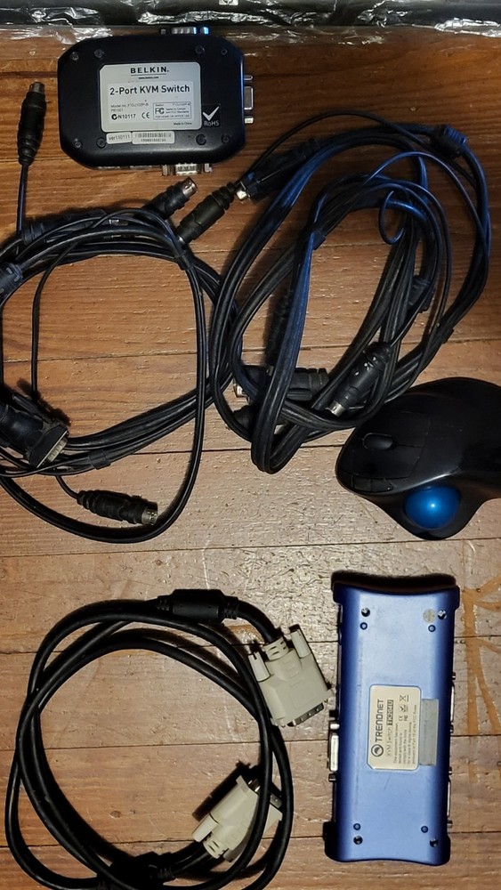 2 KVM, cables, trackball, 2 keyboards