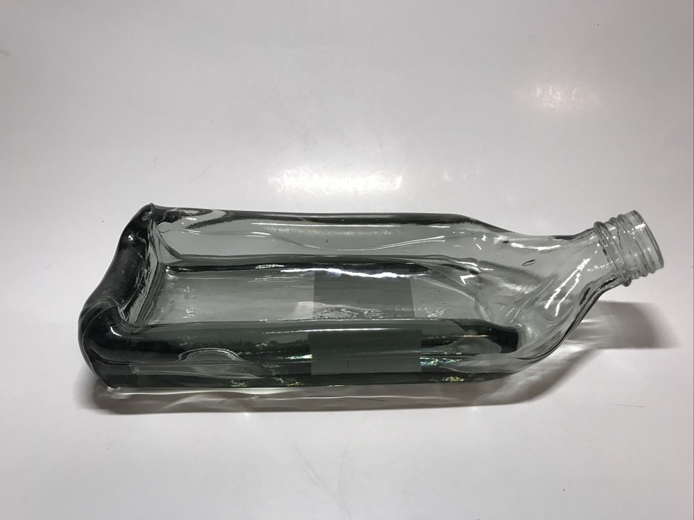 Unique Melted slumped relaxed bottle tray cheese log server bread dip