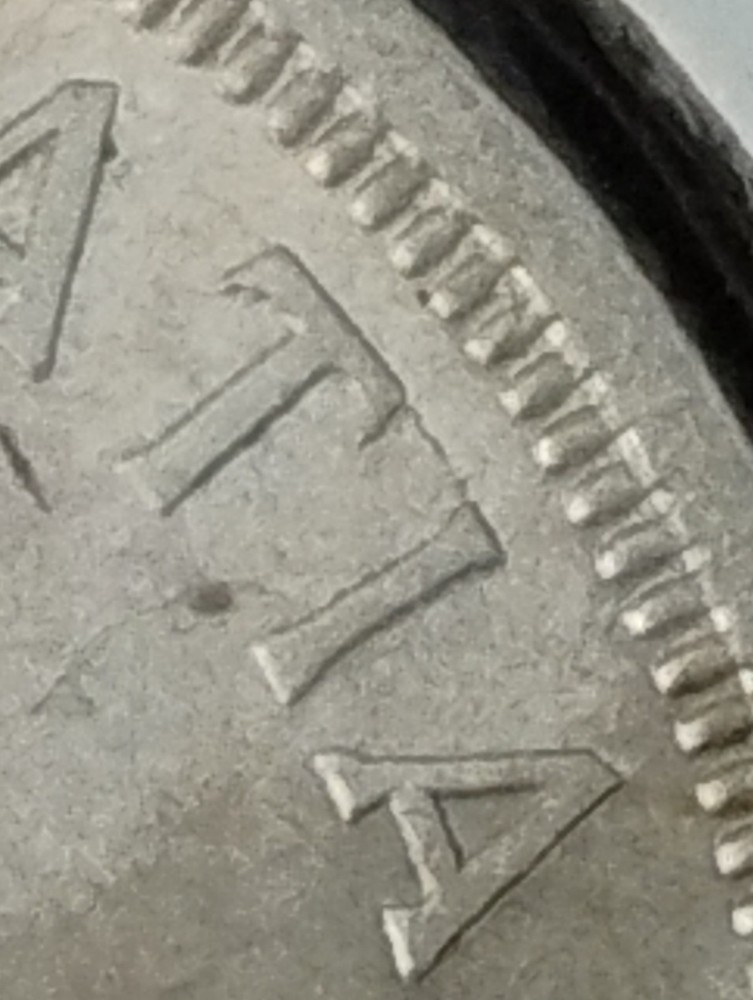 1955 Canada 1 dollar. Arn with die break