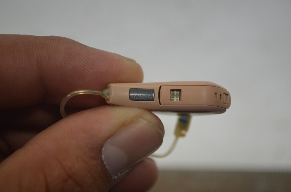 Resound Hearing Aids as is not tested missing button , might affect function
