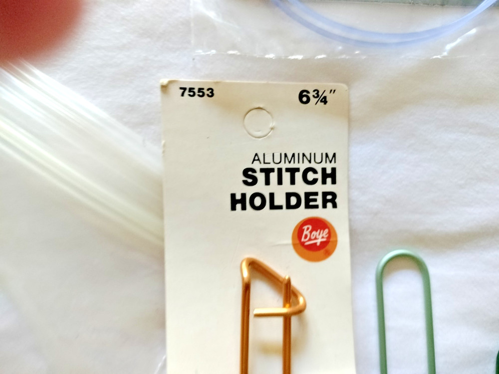 2 circluar knitting needles & 9 stitch holders