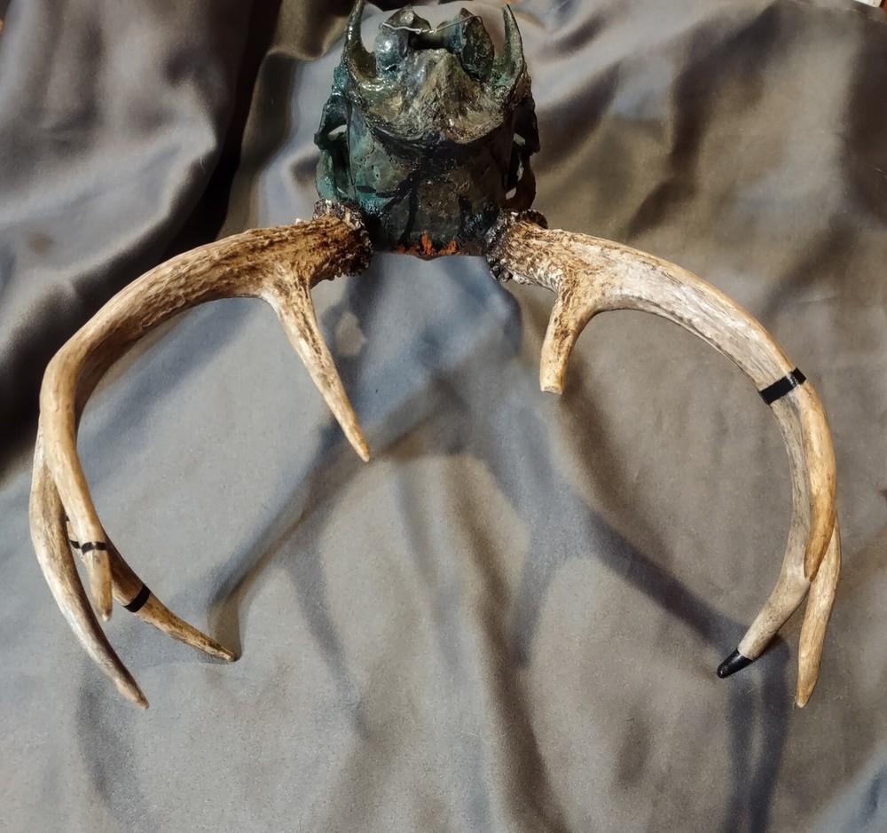 Painted European mount. 8 point, camo, grim reaper.