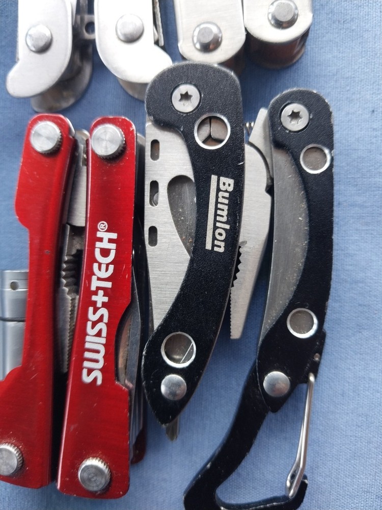 4 small multitudes with pliers knife scissors screwdriver's