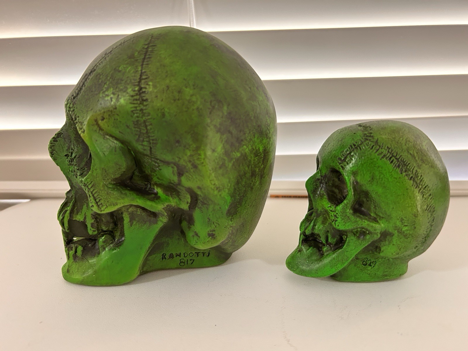 2 EA. RANDOTTI ORIGINAL FLUORESCENT GREEN LARGE & MEDIUM SKULLS STILL GLOW