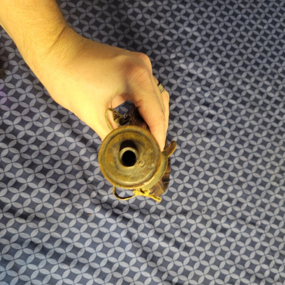1800's original powder flask large dent on front. tip may be missing.