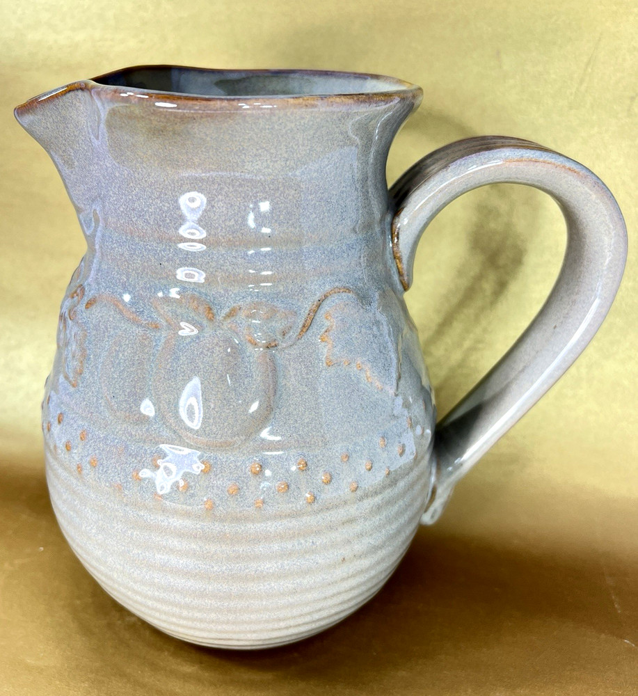 Unbranded Glazed Stoneware Pitcher embossed with fruit and glazed inside