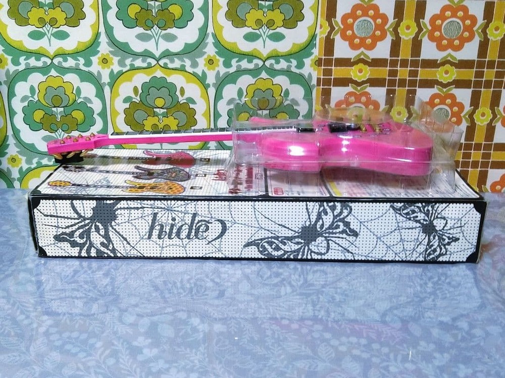 hide guitar wall clock pink