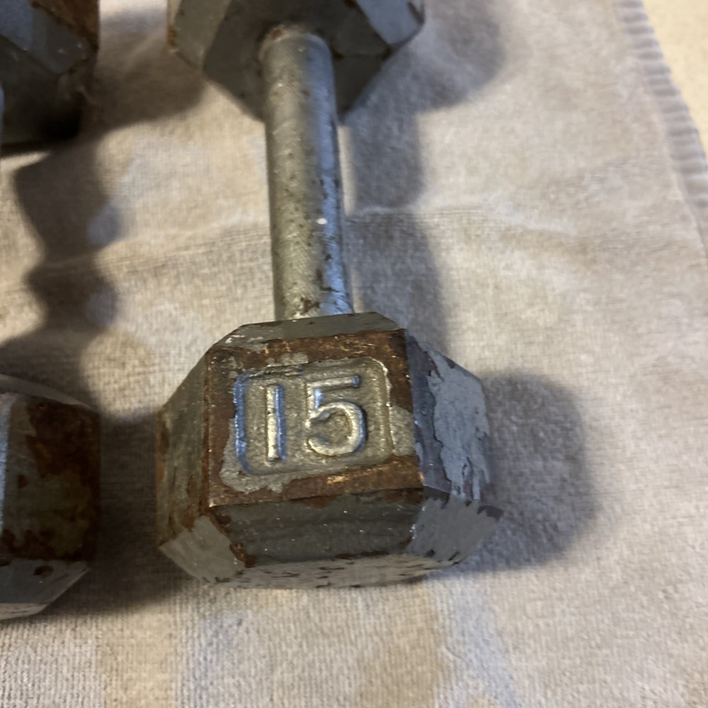 Three 15 Pound hex Head Cast Iron Dumbbells Silver