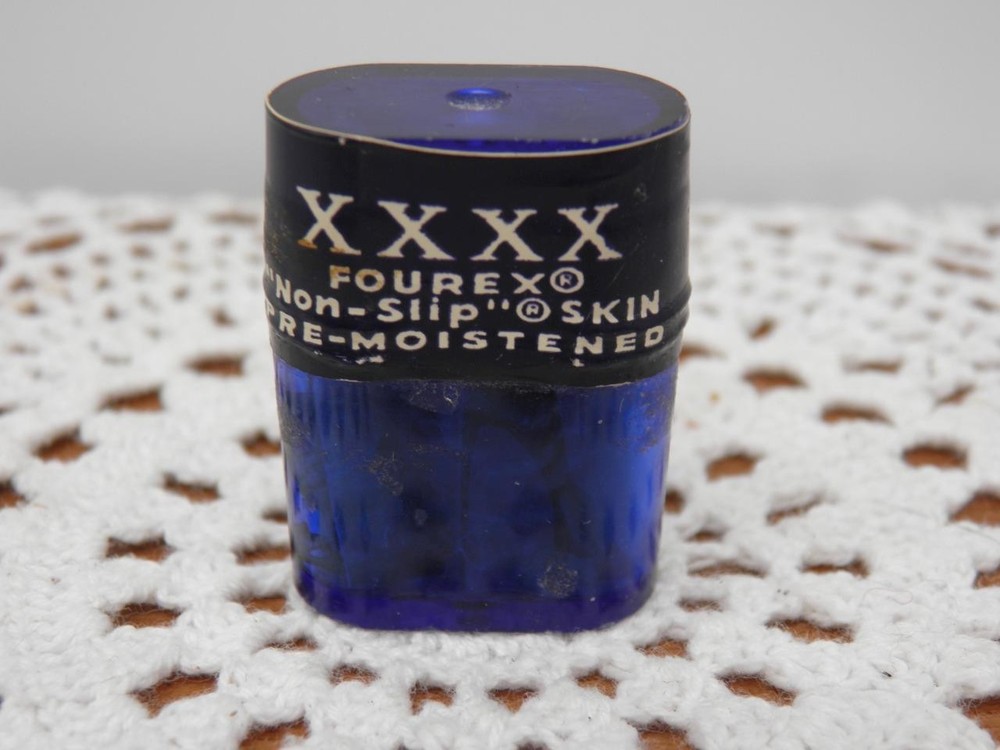 VINTAGE FOUR X CONDOMS IN TINY PLASTIC CAN