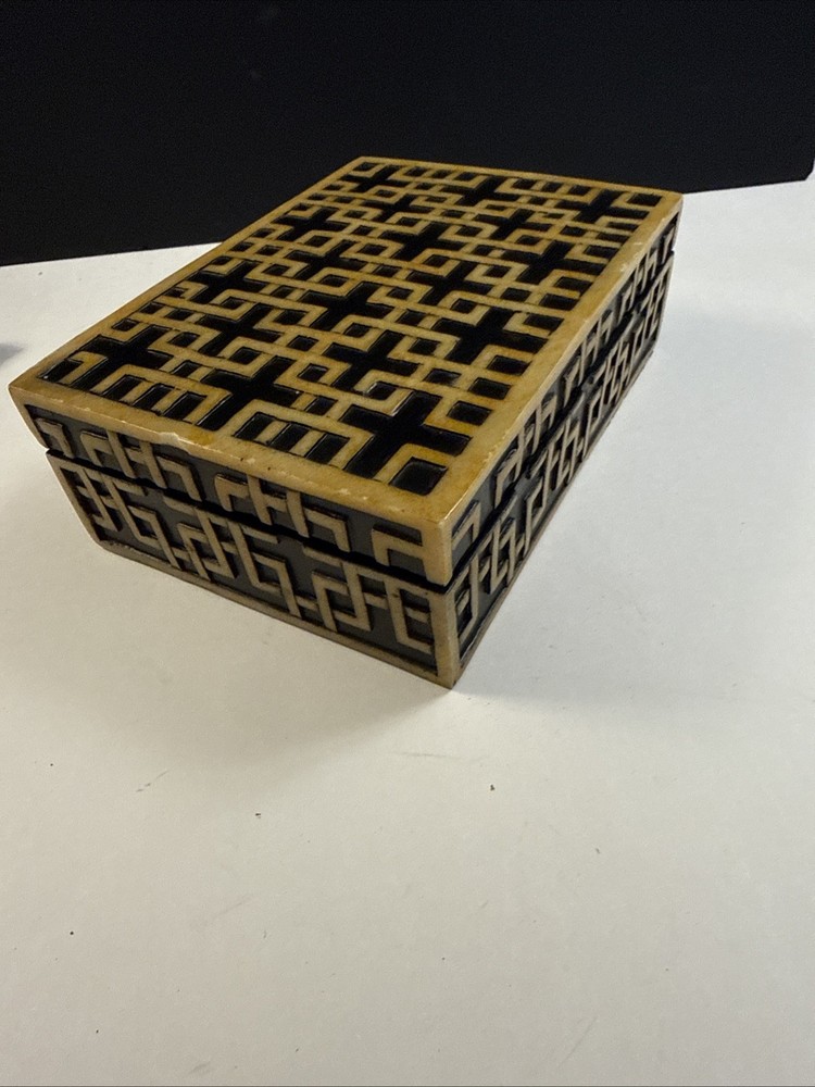 A decorative box with geometric inlay pattern, sold by Sears.