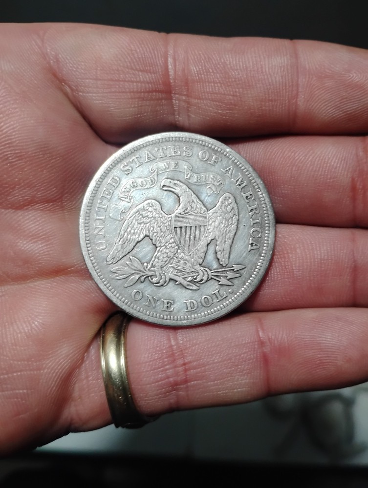 1871 seated dollar XF condition