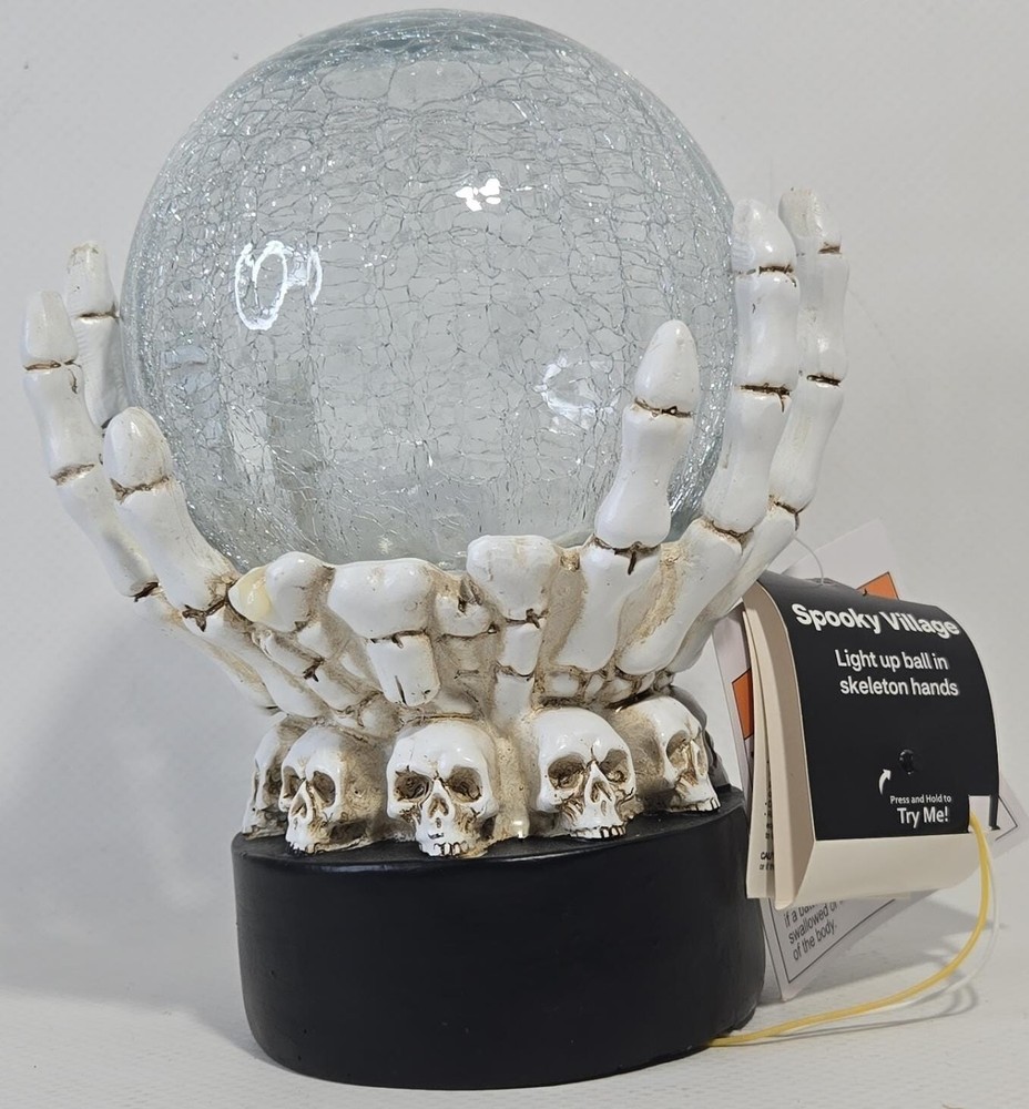 Light up Ball in Skeletal Hands and Skull Base