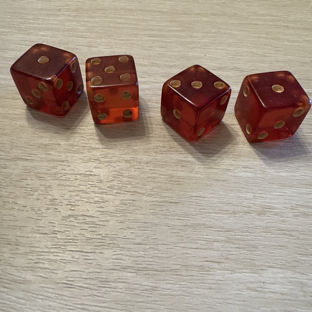 TWO pair of cherry bakelite translucent dice