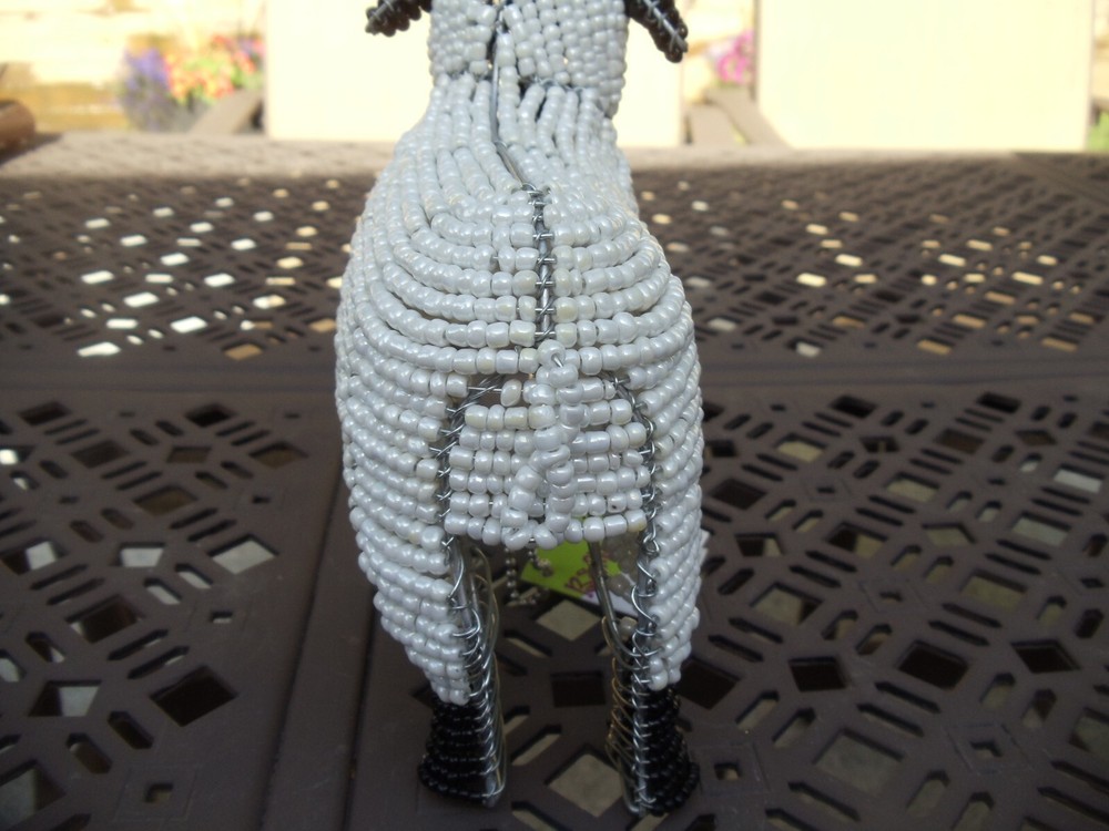 Beaded land: White sheep