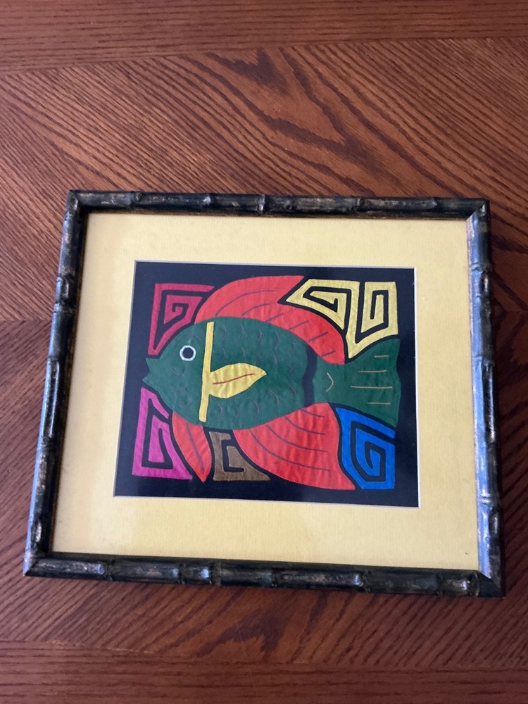 Mola, a form of textile art Multicolored fish