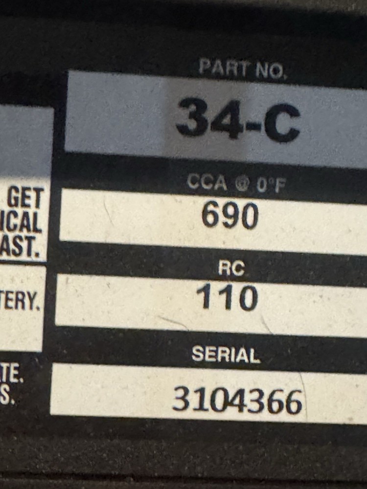 AAA 34-C Auto Battery. 690ccas 11/25 Sticker