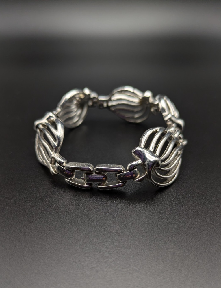 Silver-Toned Bracelet and Necklace Set Featuring Abstract Leaf Patterns