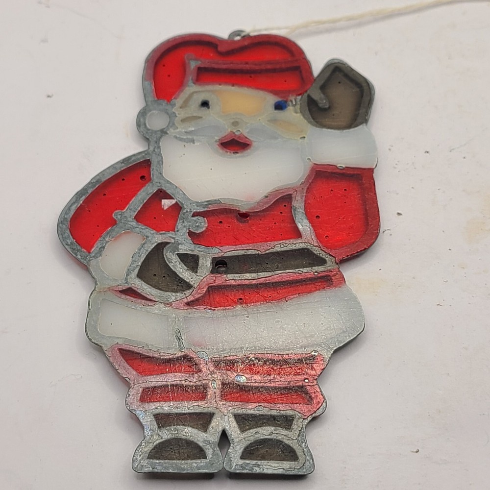 Santa sun catcher. Plastic with metal framing.