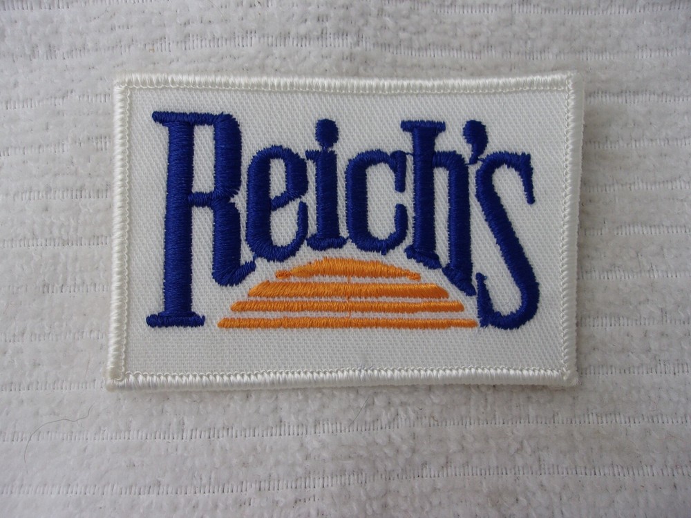 REICH'S   USED  EMBROIDERED SEW ON NAME PATCH  TAG
