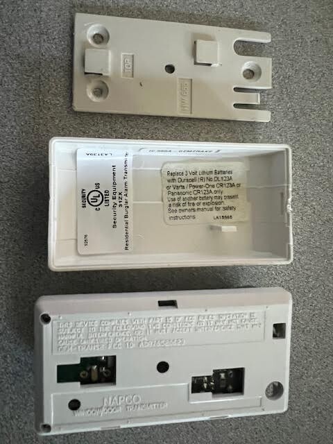 NAPCO SECURITY USED GEMINI TRANSMITTER WITH CASE LESS BATTERY