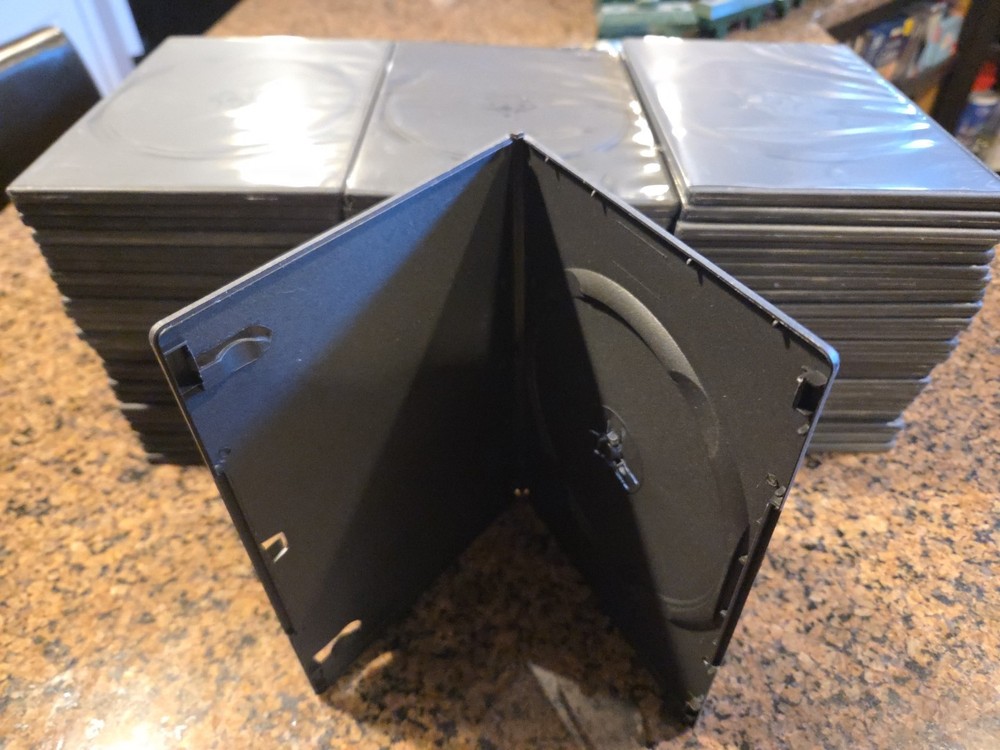 70 Black Empty Slim  DVD/CD Cases.  Quarter Inch Thick. See Description.