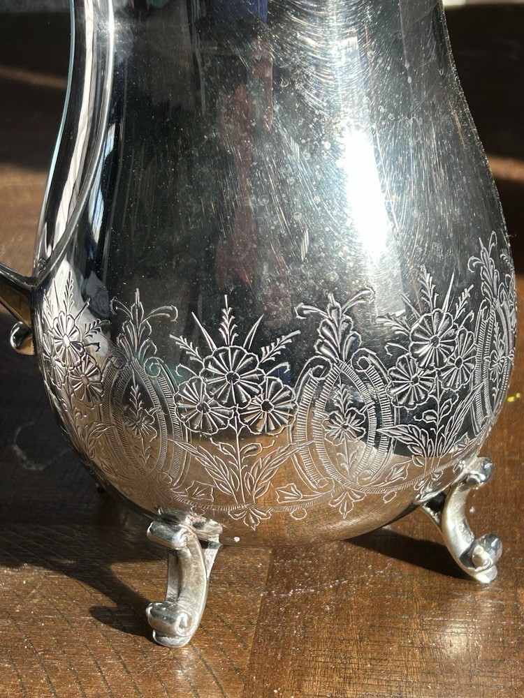 Vintage Leonard silver-plated pitcher with engraved floral pattern.