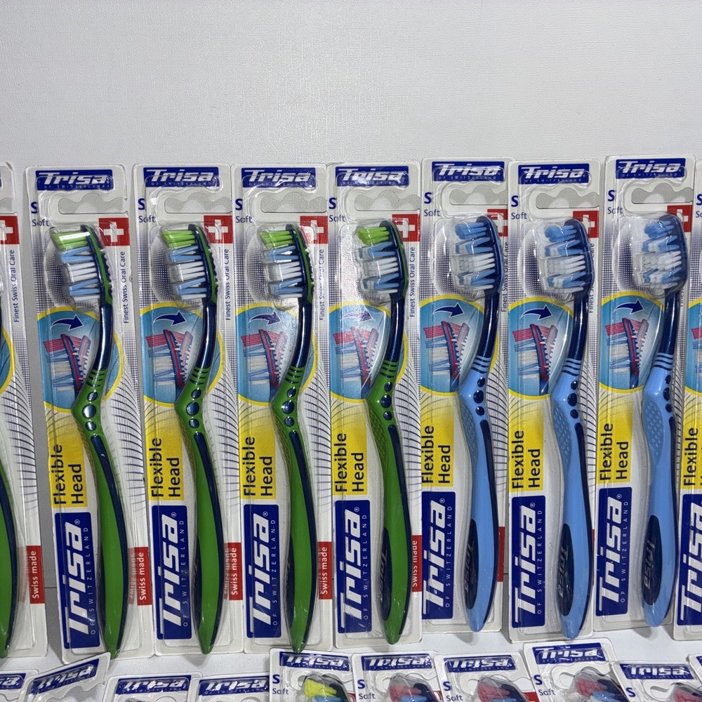 23 Trisa Flexible Head Toothbrushes/ All New