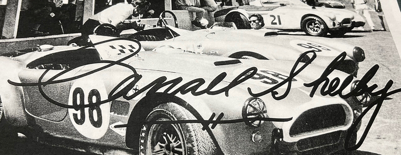 RACING 1960'S COBRAS POWERED BY FORD PHOTO WITH HUGE CARROLL SHELBY SIGNATURE!!