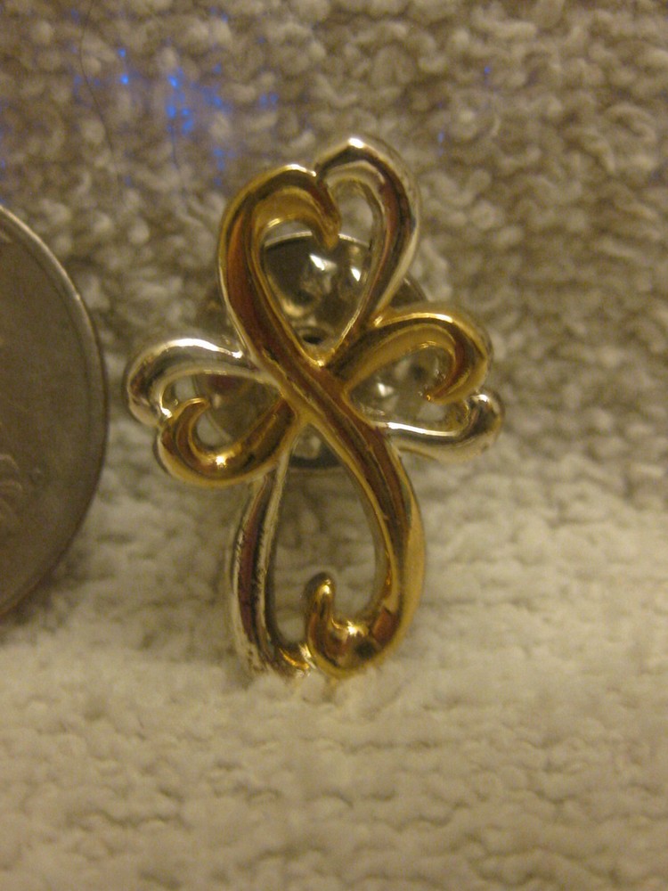 Vintage stylized cross pin