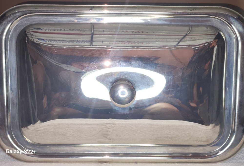 Pre-owned unknown rectangular silver-plated magnetic Lid with rounded corners.