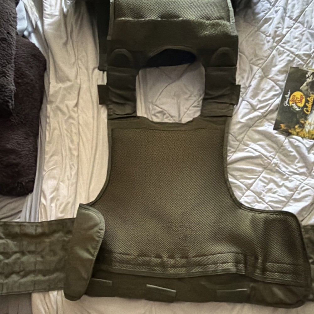 Green Tactical plate carrier.