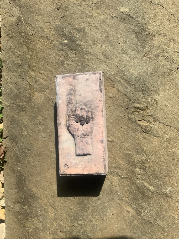Brick With Pointing Hand