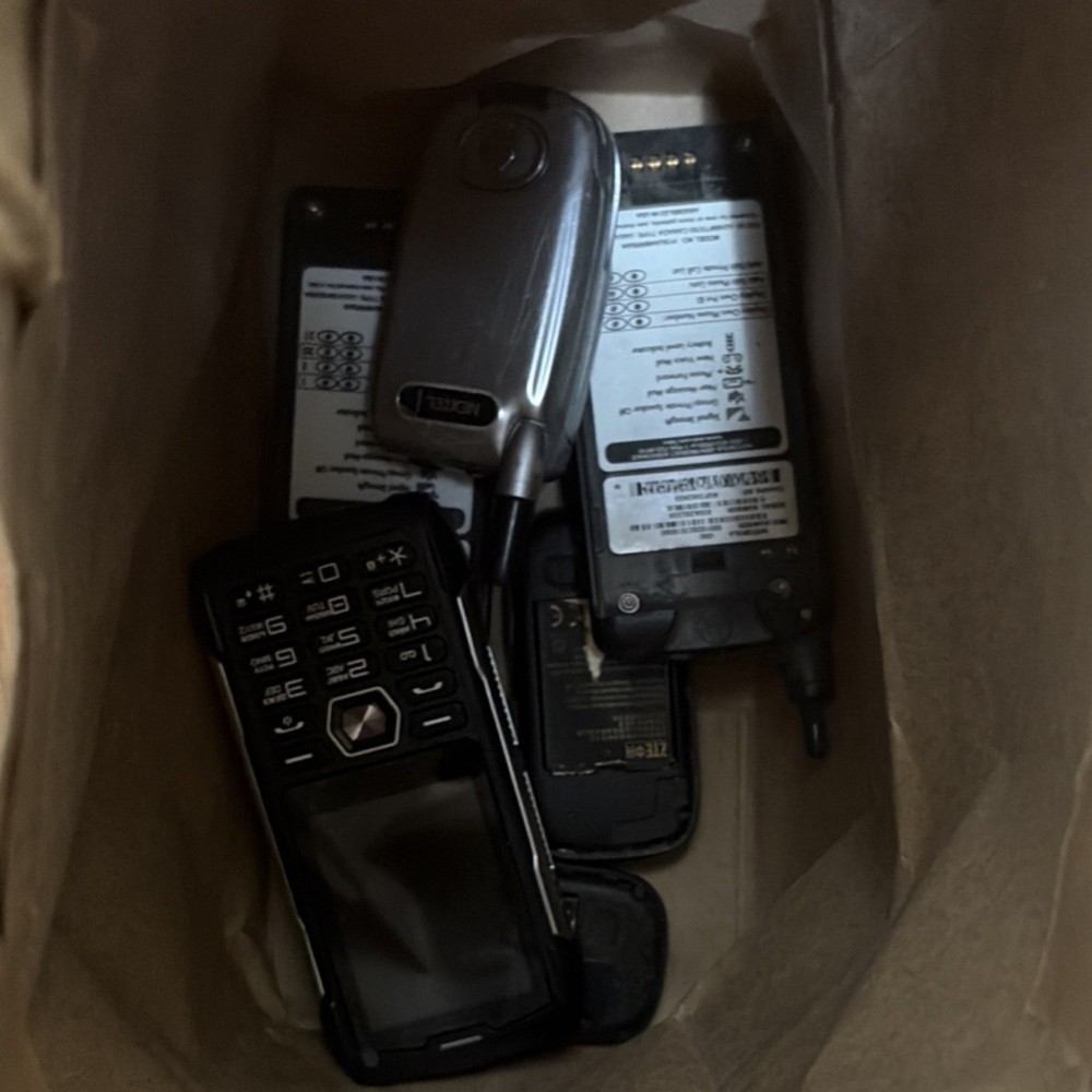 Assorted cellphones and batteries